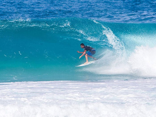 surfer in a right barrel